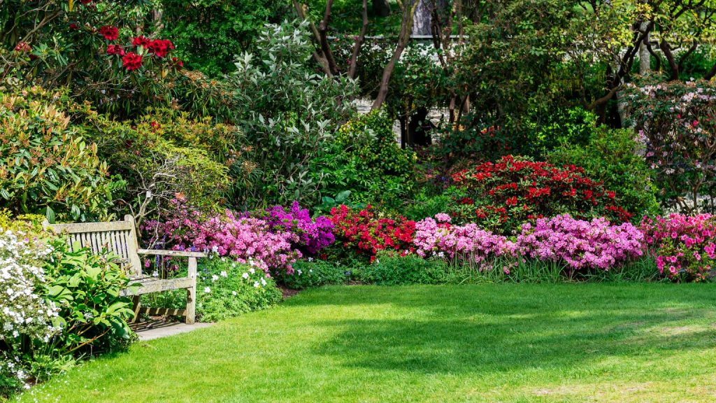 A colorful Southwest Ohio residential garden bed filled with blooming annuals and perennials in late spring after proper planting timing and soil preparation.